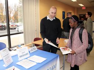 student talking to employer at career fair